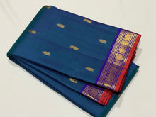 Sahana- Gorgeous Peacock Blue with Violet Combo in a handwoven pure jari Buttas Kanjivaram Silk with small borders orange jamudu with rich pallu and contrast woven blouse