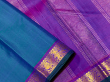 Nayaki- Peacock Blue Green with Purple Handwoven Pure Kanjivaram Silk with small borders rich seer pallu and contrast woven blouse