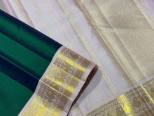 Sarasangi-Mindblowing Deep Peacock Green with Baby Pink Handwoven Pure Jari Korvai Kanjivaram Silk with gorgeous baby pink borders with paisleys woven with classic seepu seer pallu and contrast woven blouse