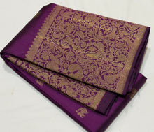 Vaibhogam- Stunning Deep Purple with Gold Handwoven Pure 2g Jari Kanjivaram Silk with beautiful yazhi and mayil buttas woven body with rich Vanasingaram borders on either sides with rich pallu and self colored blouse