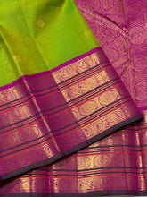 Vaibhogam- Stunning Parrot Green with Fuchsia Pink Handwoven Pure Jari Korvai Kanjivaram Silk with beautiful buttas woven body with rich varisaipet borders beautiful pallu and contrast woven blouse with bottle green selvedges