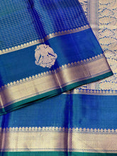 Sahana- Beautiful Peacock Blue with Gold and Green selvedges Handwoven Pure Jari Kanjivaram Silk with beautiful yazhis and gandaberunds woven both side borders kottadi jari checks woven body rich pallu and self colored blouse