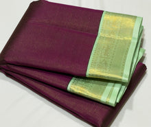 Vaibhogam- Mesmerizing Deep wine with pastel green Handwoven Pure 2g Jari Korvai Vairaoosi body with beautiful yazhis and annapakshis woven borders rich yazhi buttas woven beautiful pallu and contrast woven blouse