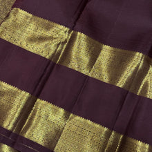 Vintage Beauty in a Rich Rust and Dark Brown Combination with Vairaoosi Jari Kattam with Mayil Chakram Buttas Doublepet borders rich pallu and contrast woven blouse