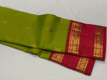 Vaibhogam- Gorgeous Parrot Green with Red Handwoven Pure Zari Korvai Kanjivaram Silk with Buttas woven body with rich doublepet vairaoosi borders with rudrakshas woven beautiful rich pallu and contrast woven red blouse