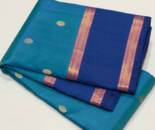 Sahana- Beautiful Blue with dark teal blue combination in a handwoven pure Jari Kanjivaram Silk with buttas woven body with rich borders beautiful pallu and contrast woven blouse