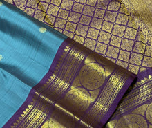 Sahana- Beautiful Teal Blue with Aubergine Purple Handwoven Pure 2g Jari Kanjivaram Silk with beautiful buttas woven body with rich elephants woven borders gorgeous pallu and contrast woven blouse