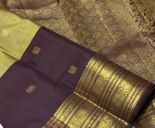 Vaibhogam- Gorgeous Elaichi Green with Coffee Brown Vairaoosi with Buttas Handwoven Pure 2g Jari Kanjivaram Silk with beautiful broad coffee brown borders rich pallu and contrast woven blouse