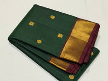 Sahana- Gorgeous Bottle Green with Deep Maroon Mayil Chakram Buttas Handwoven Pure Jari Kanjivaram Silk with beautiful bawanchi borders rich pallu and contrast woven blouse