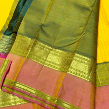 Sahana- Gorgeous Sunshine Yellow with Muthukattam Handwoven Beautiful Pure Jari Kanjivaram Silk with beautiful peachish pink with Olive Green spaced borders rich olive green pallu and contrast woven blouse