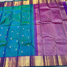Sahana- Beautiful Peacock Bluish Green with Purple Handwoven Pure Kanjivaram Silk with chakram and thilagam buttas woven body with rich borders beautiful pallu and contrast woven blouse