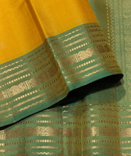 Sahana- Gorgeous Yellow with Dual tone Green Buttas Handwoven Pure Kanjivaram Silk with beautiful borders rich pallu and contrast woven blouse