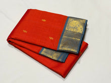 Vaibhogam- Strikingly Beautiful Fanta Orange with Grey Buttas Handwoven Pure Jari Korvai Kanjivaram Silk with beautiful borders rich pallu and contrast woven blue woven blouse