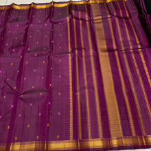 Saraswati- Beautiful Deep Magenta Handwoven Pure Zariless Kanchipuram Silk with Silk thread buttas woven all over the body with small matte finish thread borders rich pallu and self colored blouse