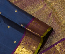 Sahana- Deep Sapphire Blue with Plum Purple Buttas Handwoven Pure Jari Kanjivaram Silk with gorgeous gandaberundas woven borders with green selvedges rich pallu and contrast woven blouse