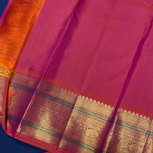 Vaibhogam- Gorgeous Peacock Blue with Orange Pink Handwoven Pure Jari Korvai Kanjivaram Silk with beautiful peacock buttas woven body with rich borders pallu and contrast woven blouse