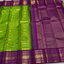 Vaibhogam- Stunning Parrot Green with Purple Handwoven Pure Zari Korvai Kanjivaram Silk with Beautiful Jari Veldhari woven body with rich varisaipet borders gorgeous palli and contrast veldhari stripes woven blouse