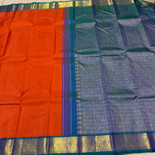 Vaibhogam- Gorgeous Burnt Orange with Peacock Blue Handwoven Pure 2g Jari Korvai Kanjivaram Silk with plain body rich borders gorgeous pallu and contrast woven blouse