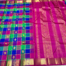 Multichecks with Buttas Rainbow Palum Pazhamum Checks with Mayil Chakram Buttas rich borders gorgeous Pink Pallu and Jari Striped Blouse Beauty