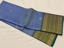 Saraswati- Powder Blue with Peacock Blue Handwoven Pure Zariless Premium Kanchipuram Silk with beautiful varisaipet borders rich pallu and contrast peacock blue blouse