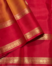 Sahana- Gorgeous Double tone Golden Mustard Shot color body with red combo in a beautiful handwoven pure Kanjivaram Silk with thilagam buttas woven with beautiful rettapet borders gorgeous simhayazhi motif woven pallu with a contrast woven red blouse