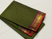 Deep Mehendi Green with Dark Magenta Handwoven Pure Jari Kanjivaram Silk with Small borders and Orange Piping with rich seer pallu and contrast woven blouse