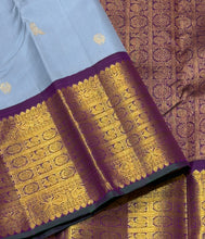 Vaibhogam- Mesmerizing Powder Greyish Blue with Deep Purple Handwoven Pure 2g Jari Korvai with Bird Buttas Woven Kanjivaram Silk with rich varisaipet borders with green selvedges gorgeous pallu and contrast woven blouse