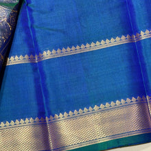 Sahana- Beautiful Peacock Blue with Gold and Green selvedges Handwoven Pure Jari Kanjivaram Silk with beautiful yazhis and gandaberunds woven both side borders kottadi jari checks woven body rich pallu and self colored blouse