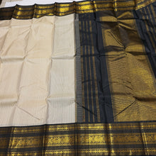 Vaibhogam- Beautiful Offwhite with Black Handwoven Pure2g Jari Korvai Kanjivaram Silk with beautiful striped body with rich borders stunning rich seer pallu and contrast woven beautiful black blouse