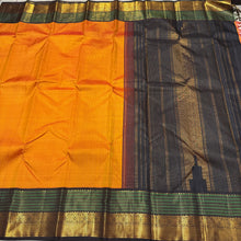 Stunning Mango Yellow with Bottle Green and Black Handwoven Jari Korvai Kanjivaram with striped body rich double side varisai borders with meenakari strips and kamalam motifs and mayilkan bhttas woven in the borders rich pallu and contrast woven blouse