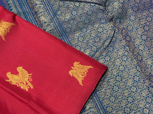 Strikingly beautiful Red with Peacock Blue Handwoven Pure Jari Borderless Muthukattam with Buttas Kanjivaram Silk Saree with double parrot motifs woven body rich pallu and contrast buttis woven blouse