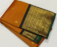 Vaibhogam- Stunning Rust with Black Handwoven Pure 2g Jari Korvai Kanjivaram Silk with mayil kuyil bird buttas with rich borders gorgeous pallu and contrast woven blouse