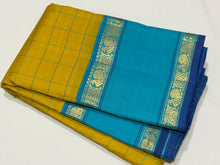 Sarasangi-Gorgeous Golden Lemon Sampanga with Sky Blue handwoven pure Jari Korvai Kanjivaram Silk with beautiful checked body with rich rettapet borders with deep blue jamudu , seer rich pallu and contrast woven blue blouse
