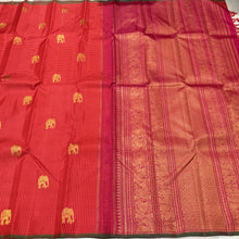 Saranga- Gorgeous Orange with Arakku Kasakasa Podikattam with Elephant motifs woven beautiful body with green selvedges rich pallu in arakku with very intricate weaving and contrast woven arakku blouse