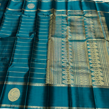 Sahana- Mesmerizing Deep Teal with Gold Handwoven Pure Jari Kanjivaram Silk with beautiful Neliveldhari Woven body with yazhis and gandaberundas woven beautiful doublepet borders with rich and self colored blouse