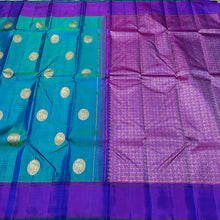 Gorgeous Dual tone Peacock Blue Green with Purple Handwoven pure Jari Kanjivaram Silk Saree with Horse motifs woven body plain beautiful borders rich mayil chakram buttas woven pallu and contrast woven blouse