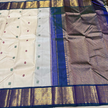 Stunning Handwoven Pure Jari Kai Korvai Kanjivaram Silk Saree in Offwhite body with Sapphire Blue combination with rich pattu buttas woven body gorgeous borders rich pallu and contrast woven blouse