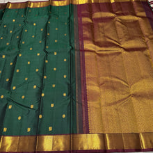 Sahana- Gorgeous Bottle Green with Deep Maroon Mayil Chakram Buttas Handwoven Pure Jari Kanjivaram Silk with beautiful bawanchi borders rich pallu and contrast woven blouse