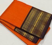 Vaibhogam- Strikingly beautiful Orange with Dark Beetlebut Brown Handwoven Pure2g Jari Korvai Kanjivaram Silk with beautiful Vairaoosi woven rich body with gorgeous varisaipet borders rich pallu and contrast woven beautiful blouse