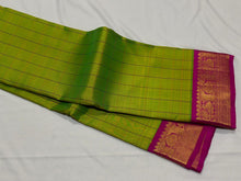 Sarasangi- Stunning Parrot Green with Pink Handwoven Pure Jari Korvai Kanjivaram Silk with beautiful checked body rich borders pallu and contrast woven blouse