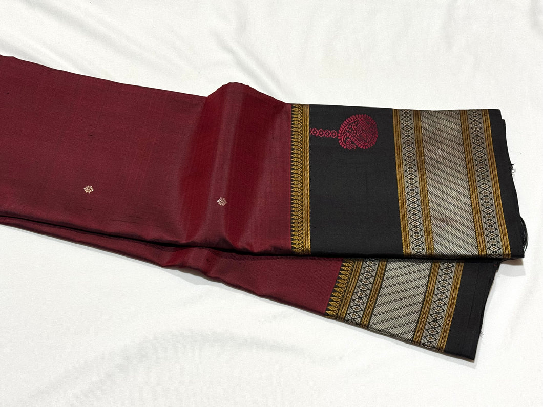 Premium Weave- Deep Maroon with Black Handwoven Pure Zariless Kanjivaram Silk Saree with Buttas woven body spaced double borders shanku motifs woven pallu beauty