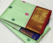 Vaibhogam- Gorgeous Pista Green with Violetish blue and Burgundy Maroon Handwoven Pure 2g Jari Korvai Kanjivaram Silk with Pattu Buttas woven body rich borders ganga Jamuna beautiful pallu and contrast woven blouse
