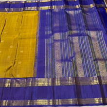Sahana- Gorgeous Bronze Gold with Violetish Blue Handwoven Pure Jari Kanjivaram Silk with buttas woven body with doublepet borders with gorgeous meenakari woven pallu and contrast woven blouse