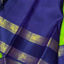 Vaibhogam- Gorgeous Bright Green with Deep Blue Handwoven Pure 2g Jari Korvai Kanjivaram Silk with beautiful chakram and gandaberunda motifs woven body with beautiful silk threads and jari woven doublepet borders gorgeous pallu and contrast woven blouse