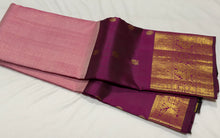 Vaibhogam- Mesmerizing Lotus Pink with Dark Magenta Purple Handwoven Pure 2g Jari KanjivaramSilk with Jarioosi checked body with beautiful mayil chakram motifs woven middle borders with beautiful long and short lower borders pallu and contrast wove blouse