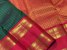 Vaibhogam-Super Gorgeous Bottle Green with Red Handwoven Pure Jari Korvai with oosi vanam lines with Rudraksha buttas woven all over body with Doublepet Rich Borders with rich and finely woven beautiful Pallu and Contrast woven red blouse