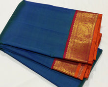 Sarasangi- Gorgeous Peacock Blue with Arakku Red Handwoven Pure Jari Korvai Kanjivaram Silk with beautiful borders with orange selvedges rich pallu and contrast woven blouse