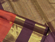 Vintage Beauty in a Rich Rust and Dark Brown Combination with Vairaoosi Jari Kattam with Mayil Chakram Buttas Doublepet borders rich pallu and contrast woven blouse