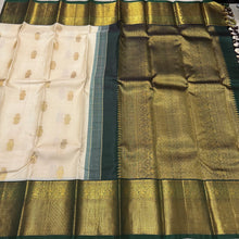 Stunning Ivory white with bottlegreen Handwoven Pure Jari Korvai Kanjivaram Silk Saree with gorgeous Gandaberunda motifs woven body rich borders pallu and contrast woven blouse