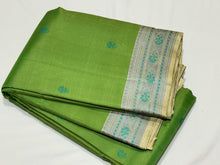 Gorgeous Parrot Green with Beige and Blue Handwoven Pure Zariless Kanjivaram Silk with beautiful thread buttas woven body with gorgeous borders pallu and striped blouse